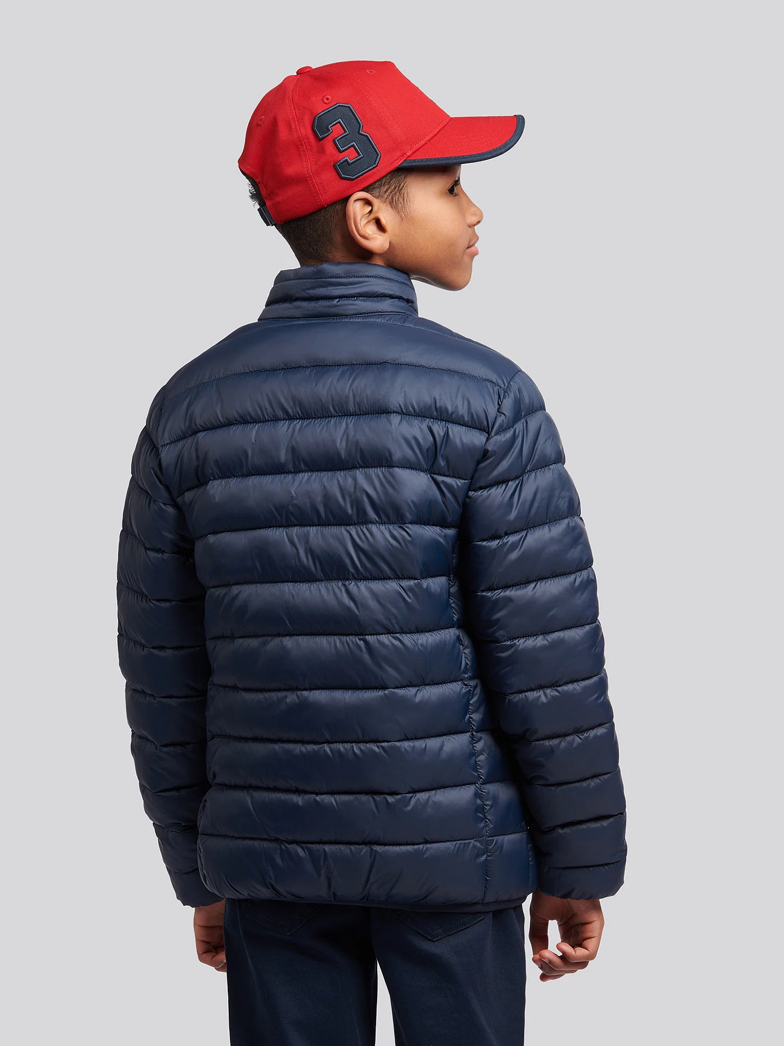 Boys Lightweight Bound Quilted Jacket in Dark Sapphire Navy / Haute Red DHM - Image 4