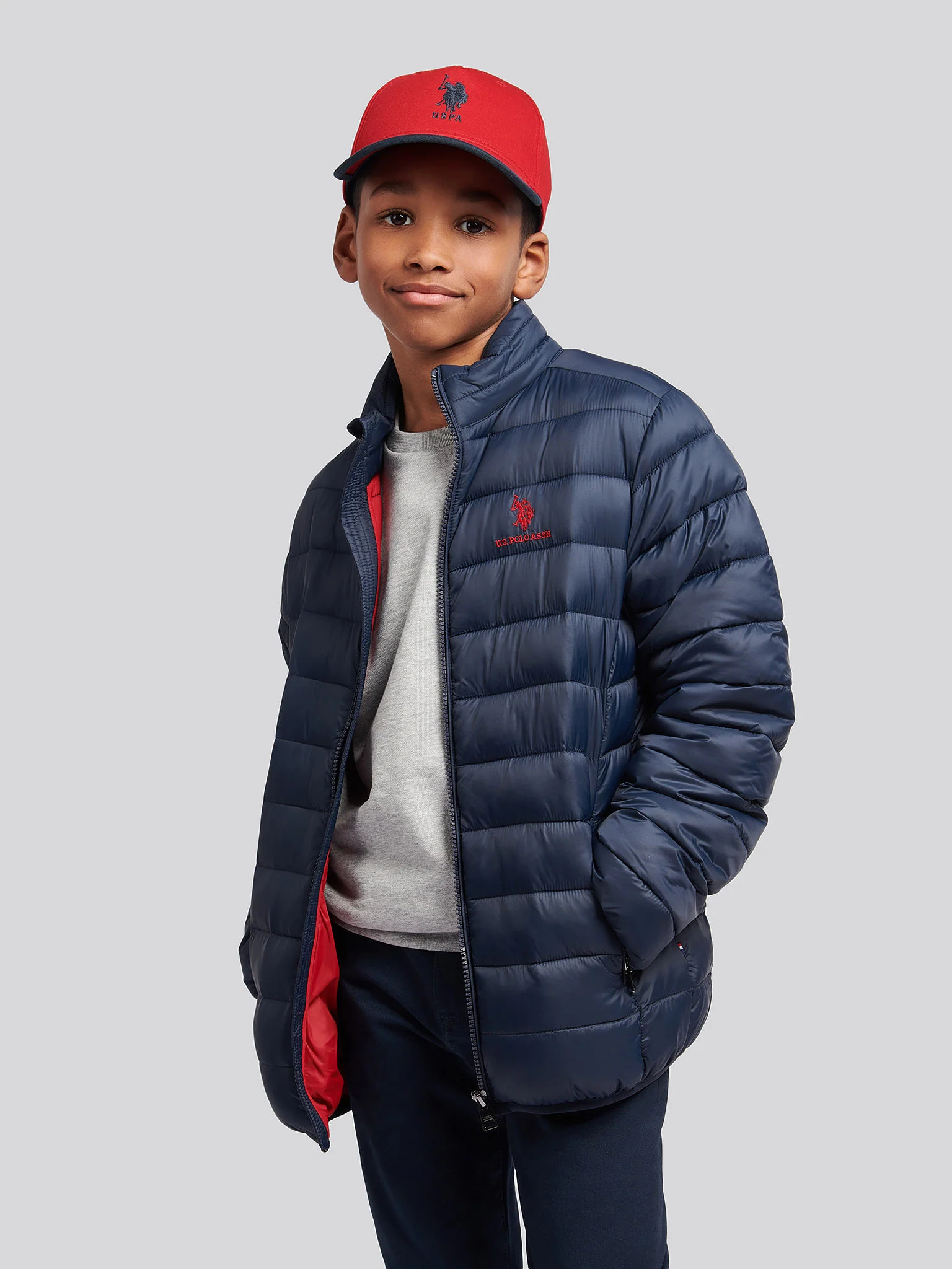 Boys Lightweight Bound Quilted Jacket in Dark Sapphire Navy / Haute Red DHM - Image 5