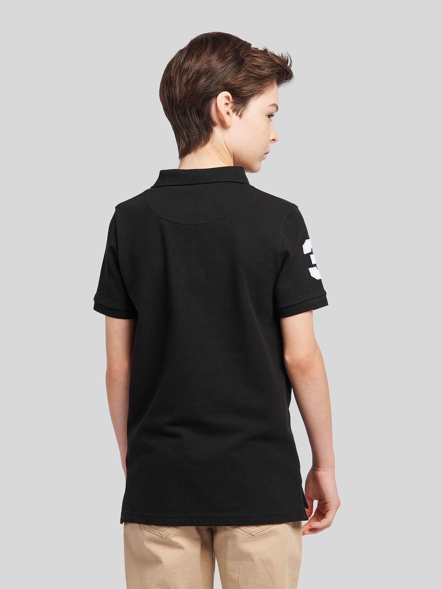 Boys Player 3 Polo Shirt in Black Bright White DHM - Image 4